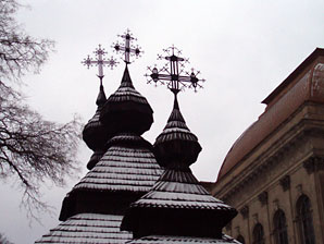 crosses atop wooden church
